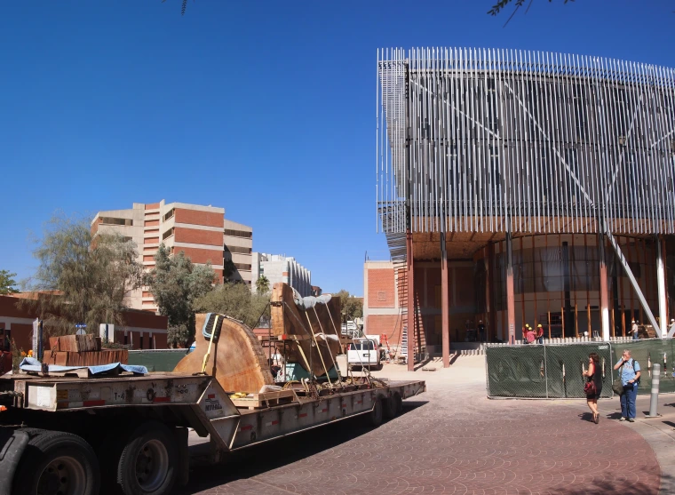 All the pieces on the truck, new building in the background